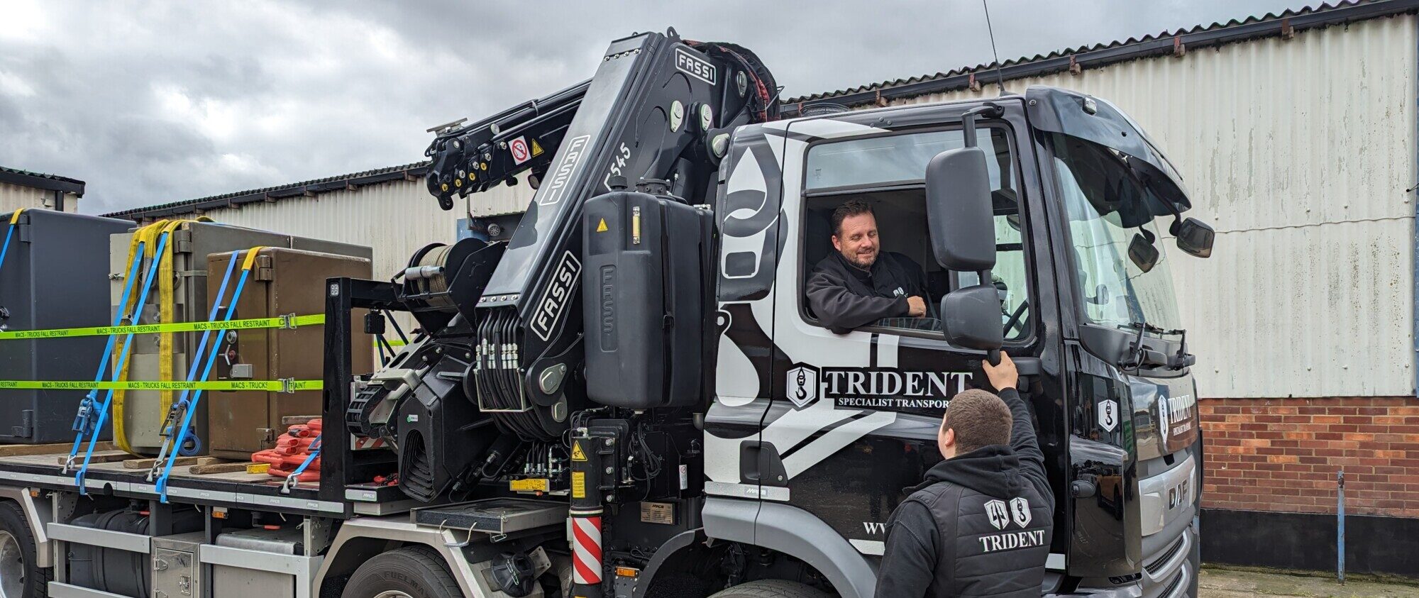 Trident transport team members in front of Trident branded HIAB Lorry